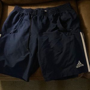 Navy adidas shorts.